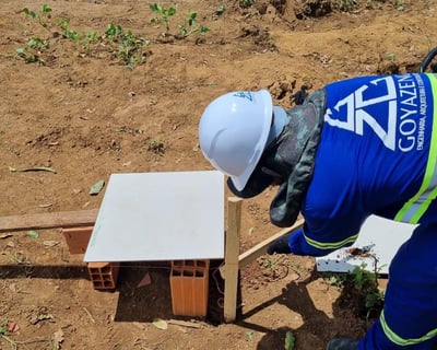 a man in a blue suit and a white helmet
