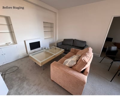 a living room with 2 sofas and oversized coffee table