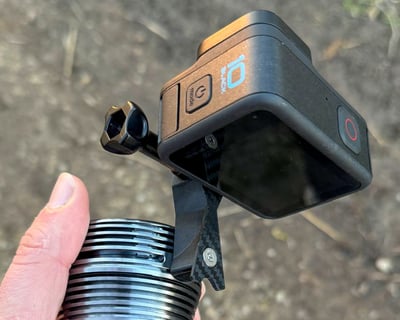 a person holding a camera and a light