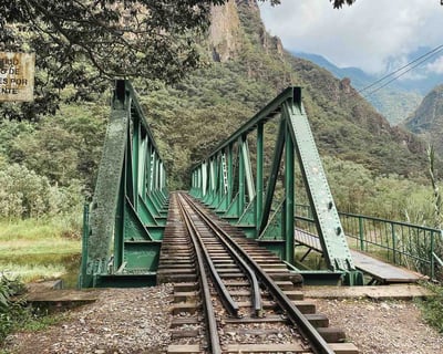 Green bridge and train tracks on the Aguacalientes trail to Hydroeléctrica in Peru.