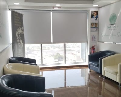 Modern blackout roller blind fully extended blocking out sunlight for complete privacy 