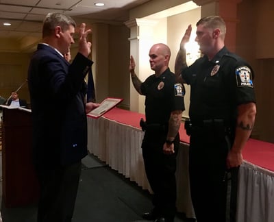 Mayor Holmes swears in two new officers