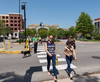 People walking across a crosswalk