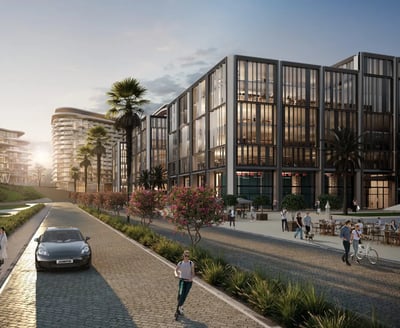Sunset boulevard view of One Ninety’s Business Quarter with modern glass buildings