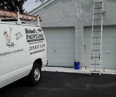 a van parked in front of a garage door