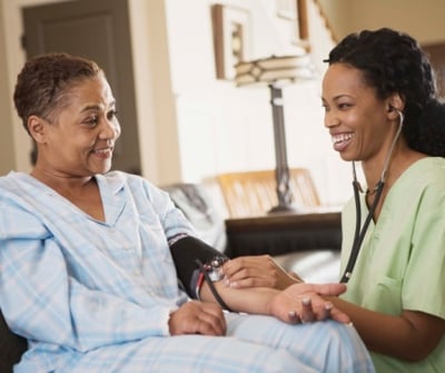 a nurse and a nurse in a hospital room