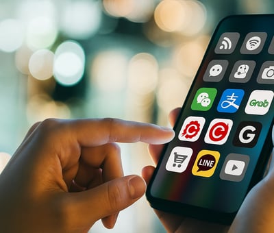 a person holding a phone with a phone in their hand