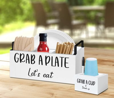 a wooden crate with a sign that says grab a plate let's eat