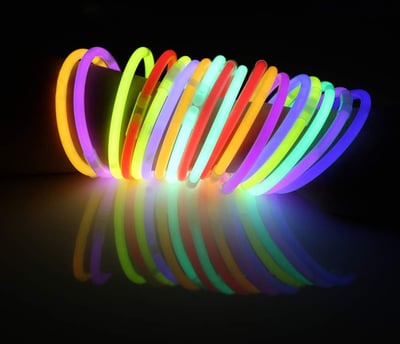 a group of neon - colored bracelets with neon lights