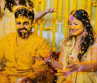 a man and woman in yellow and yellow colored clothes