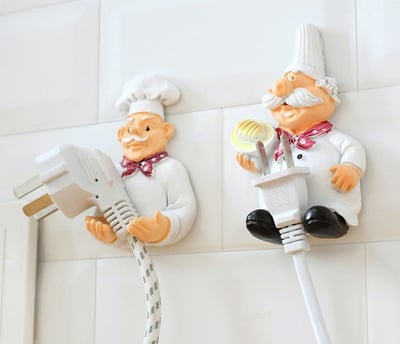 a couple of figurines of chefs and a plugged in a plugged