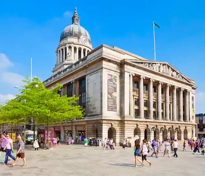 a large building with a dome shaped building in the middle of it