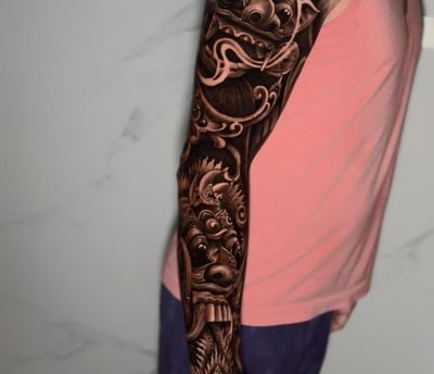 Balinese barong tattoo design on forearm
