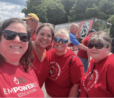 4 women in red "Empowered Educators" tshirts on