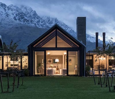 a house with a view of a mountain in the background
