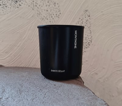 natural hand poured luxury candle illuminating pine and earth