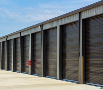 a row of storage units with doors closed