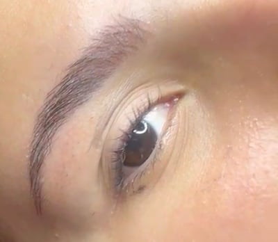 a woman with a black eyeliners and a black eyeliners Sol Contreras