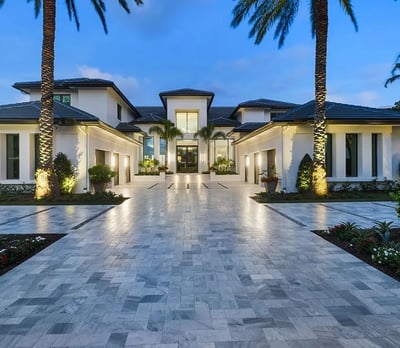 a large house with a driveway leading to a large driveway