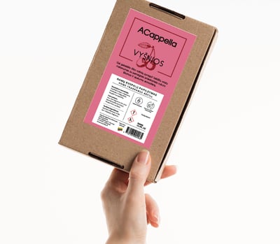 hand holding craft box with colored home scent label