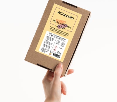 hand holding craft box with colored home scent label