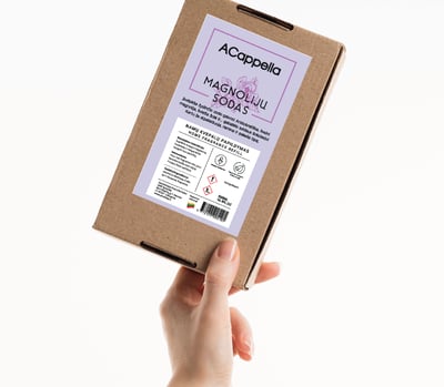 hand holding craft box with colored home scent label