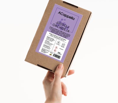 hand holding craft box with colored home scent label