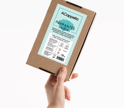hand holding craft box with colored label