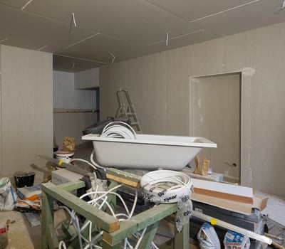 a bathtub with a tub tub and a tub, construction debris, garbage, contractor