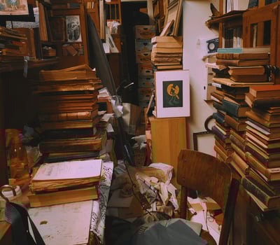 a room with a lot of books and a desk. Clutter, hoarding, hoarder, junk