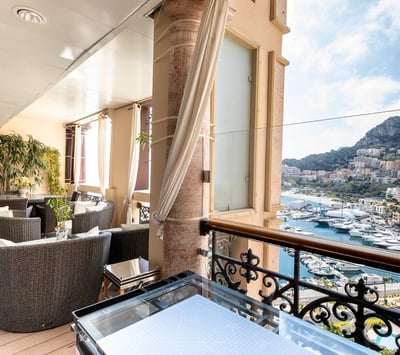 A balcony in Monaco with a view of the city and Monte Carlo harbour