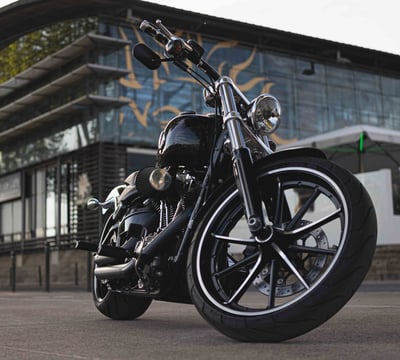 a motorcycle parked in front of a building