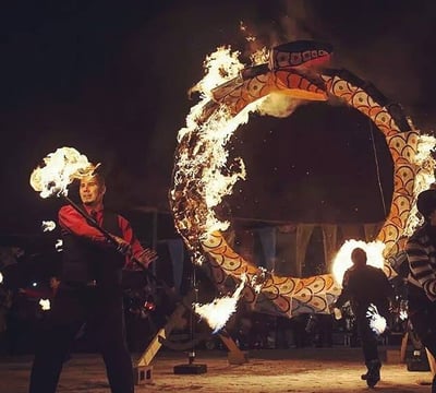Fire Staff in front of large burning sculpture