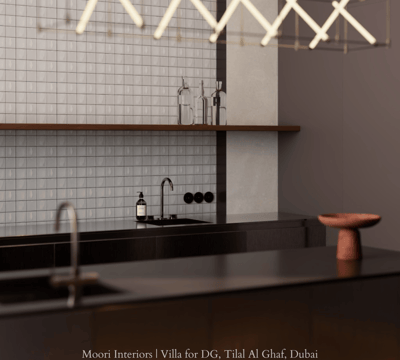 Contemporary kitchen design featuring a dark countertop and illuminated by a linear light fixture.