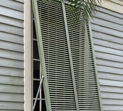 green bahama shutter on a house in new orleans