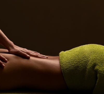 a woman getting a massage at a spa