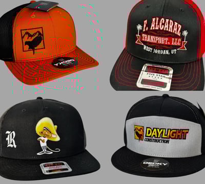 Custom embroidered trucker hats with company logos and personalized designs, including construction.