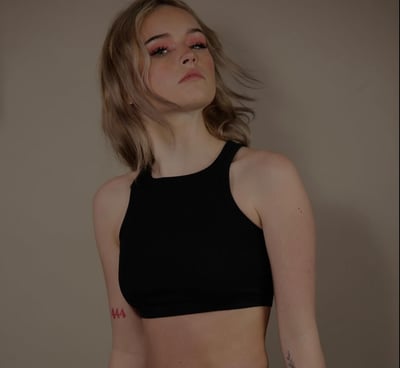 a woman in a black top and a black underwear briefie