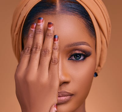a woman with a turban and a head scarf