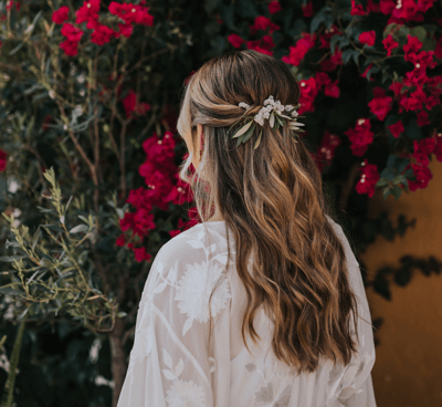 Half up half down wedding hairstyle with natural flowers Hugo Coelho Photography