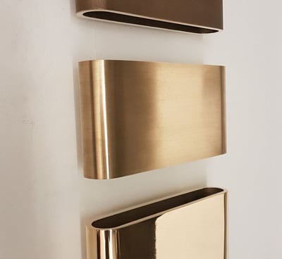 a set of three metal wall mounted shelves