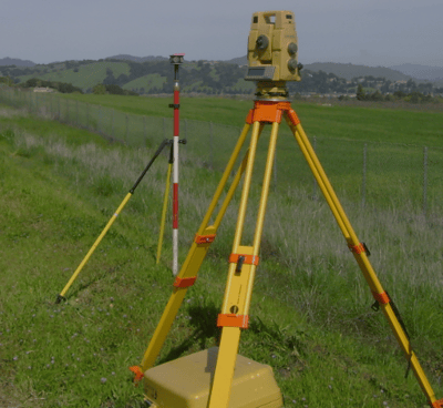 a tripod with a camera and a tripod