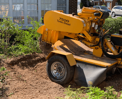 a machine is being used to remove dirt from the ground