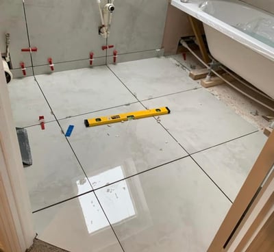 bathroom flooor tiling by axm plumbing