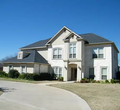 a house with a driveway and driveway with a driveway