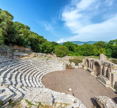 a large stone structure with a circular shaped seating area