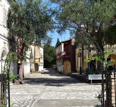 a gated in area with a bench and a bench