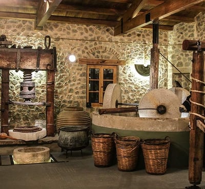 a room with a stone wall and a horse