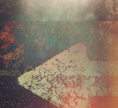 An abstract photograph of an arrow pointing to the left.