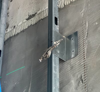 Light-gauge steel stud framing installation in a Washington DC commercial building interior